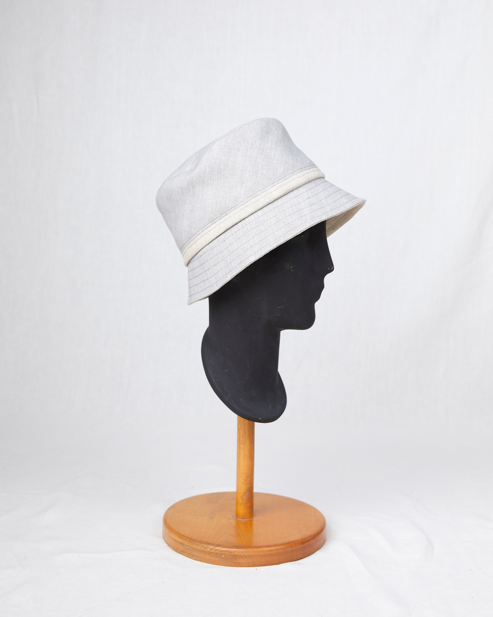 HEADQUARTER | couture headwear Bucket hat made of double face linen. Designed and handcrafted in Switzerland.