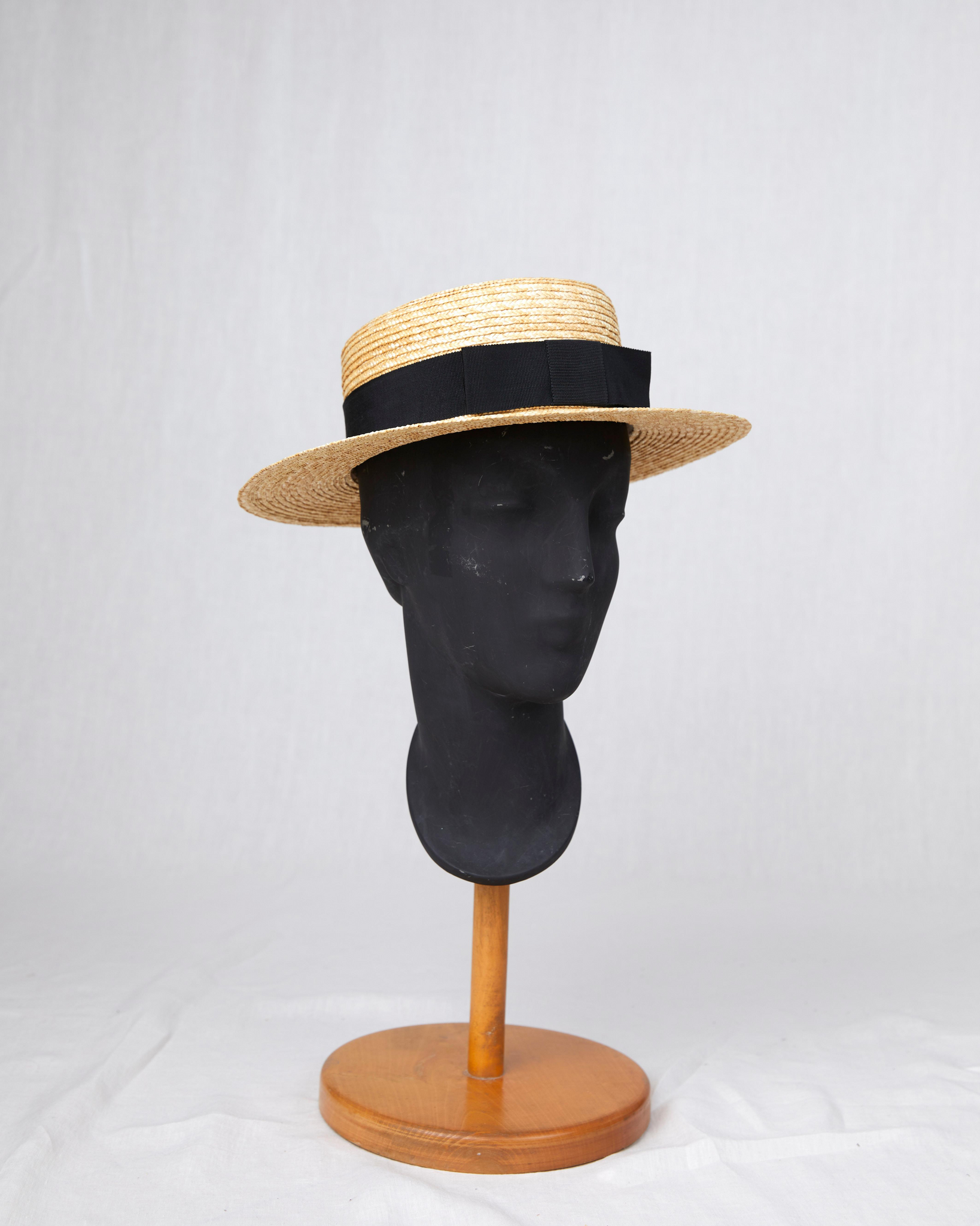 HEADQUARTER | couture headwear Canotier. Classical hat shape made of wheat straw braids sewn by hand. Designed and handcrafted in Switzerland.